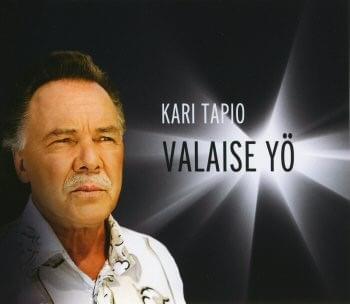 Album cover art for "Valaise yö" by Kari Tapio