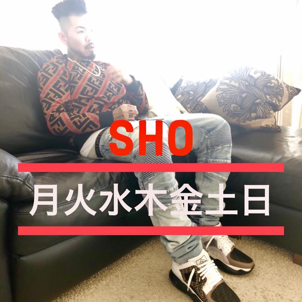Album cover art for "月火水木金土日 (MONDAY, TUESDAY, WEDNESDAY, THURSDAY, FRIDAY, SATURDAY, SUNDAY)" by SHO