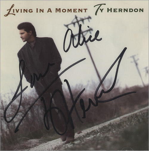 Album cover art for "Living in a Moment" by Ty Herndon