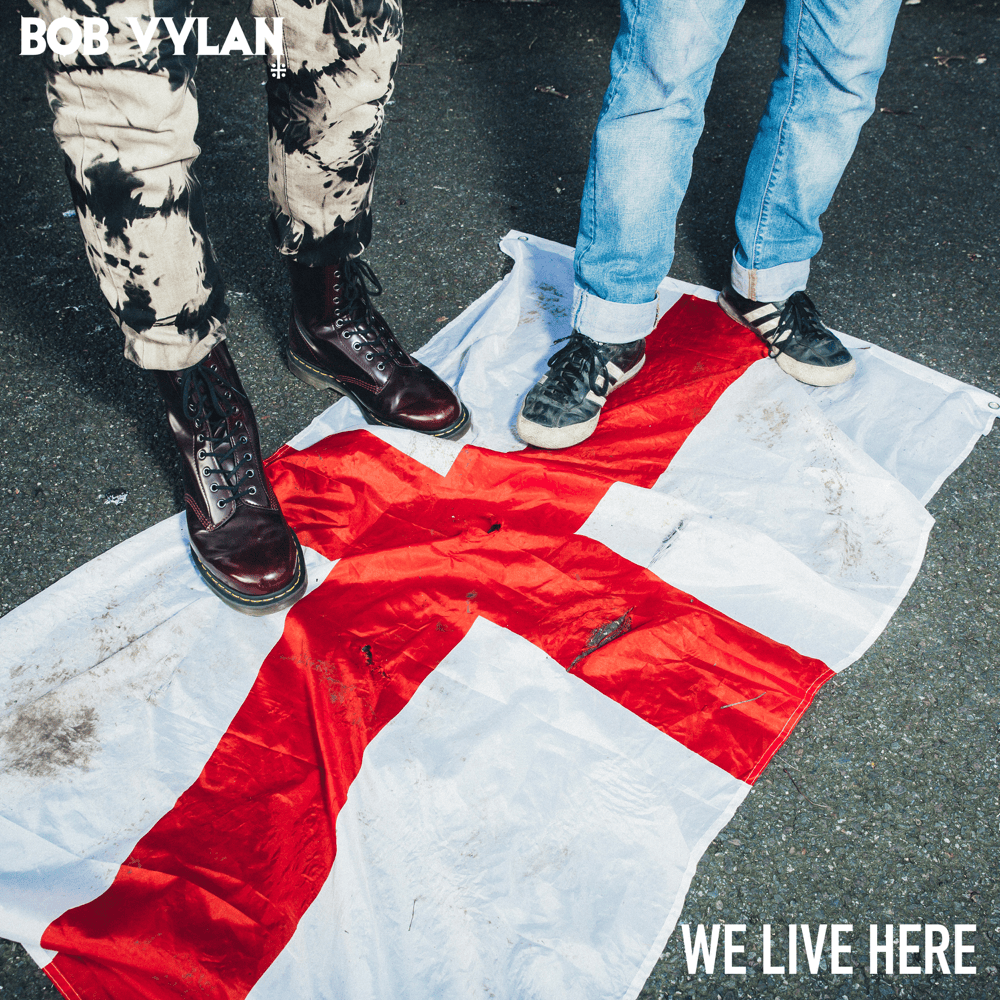 Album cover art for "We Live Here" by Bob Vylan