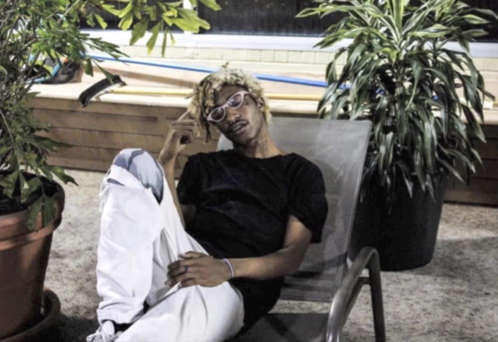 Album cover art for "BLUNT SMOKIN YUNG NIGGAS WE SCREAM FUCK 12" by Lil Tracy