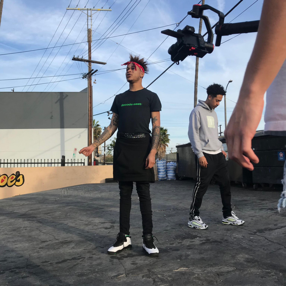 Album cover art for "POPPING (Remix)" by Lil Xelly