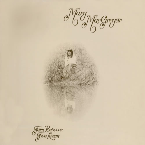 Album cover art for "Torn Between Two Lovers" by NOW That’s What I Call Music!