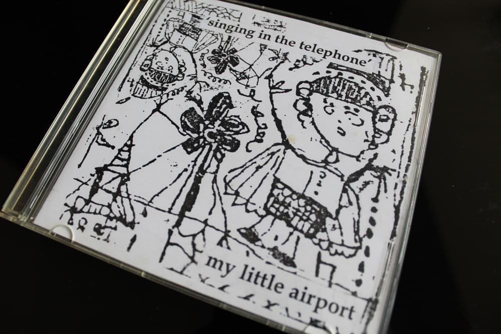 Cover image for singing in the telephone