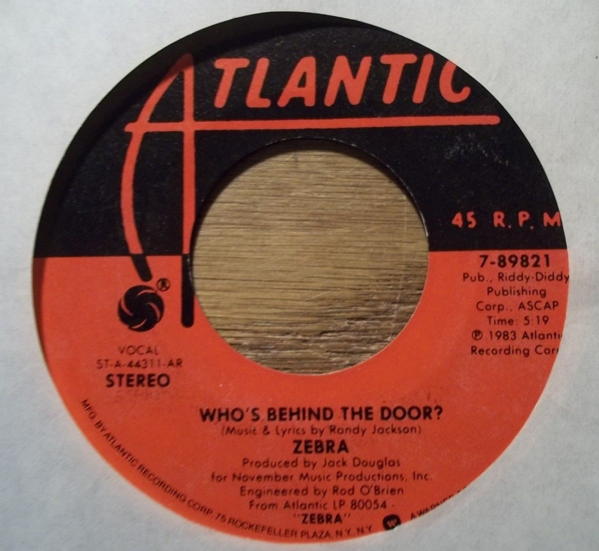 Album cover art for "Who’s Behind the Door?" by Zebra