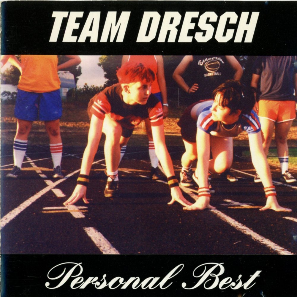 Album cover art for "She’s Amazing" by Team Dresch