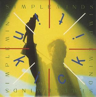 Album cover art for "Kick It In" by Simple Minds