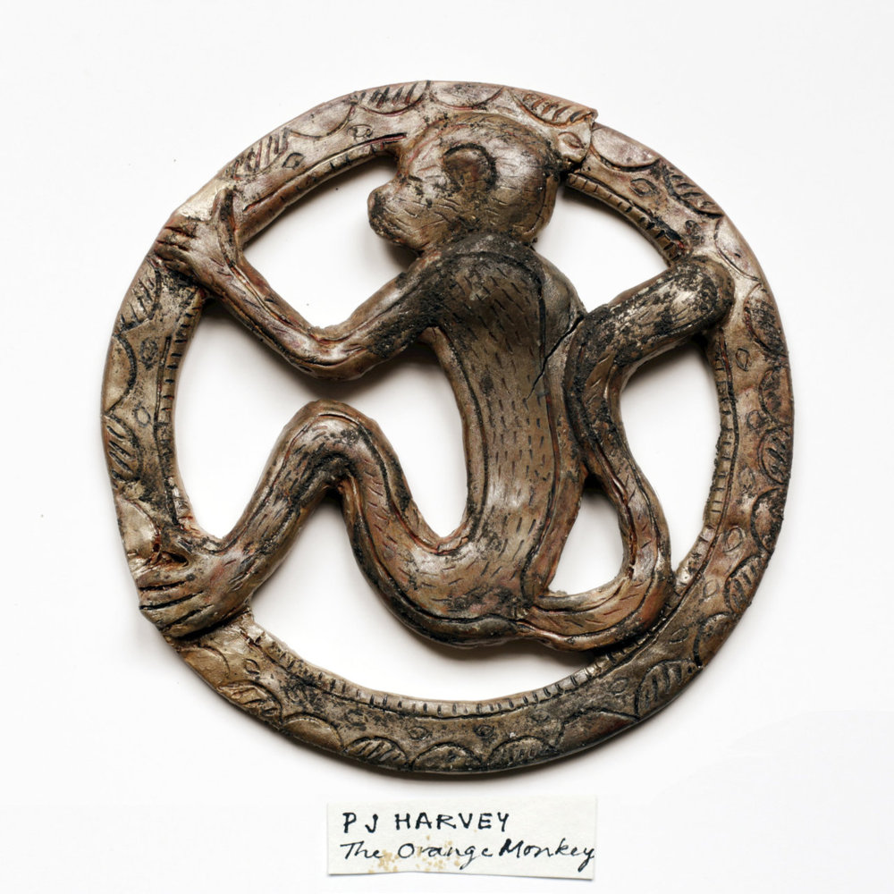 Album cover art for "The Orange Monkey" by PJ Harvey