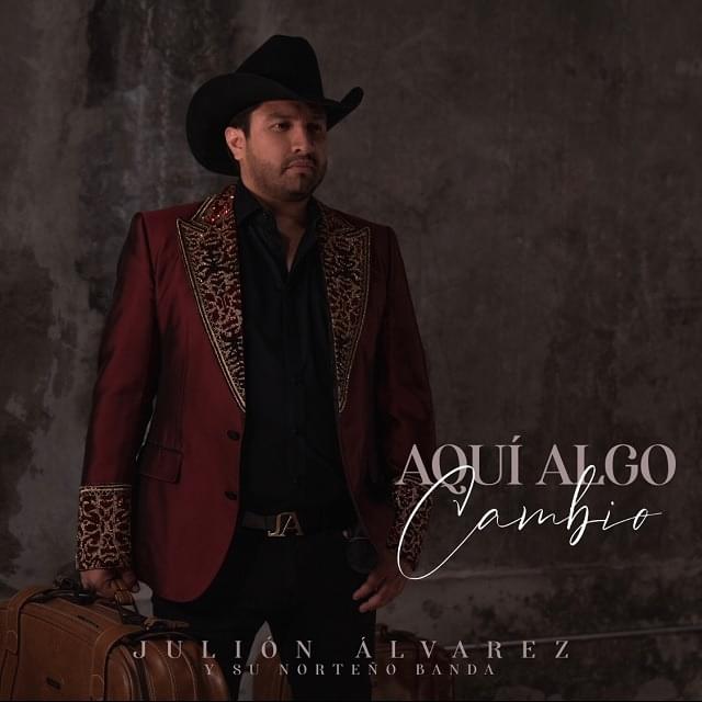 Album cover art for "Aquí Algo Cambió" by Julión Álvarez y su Norteño Banda