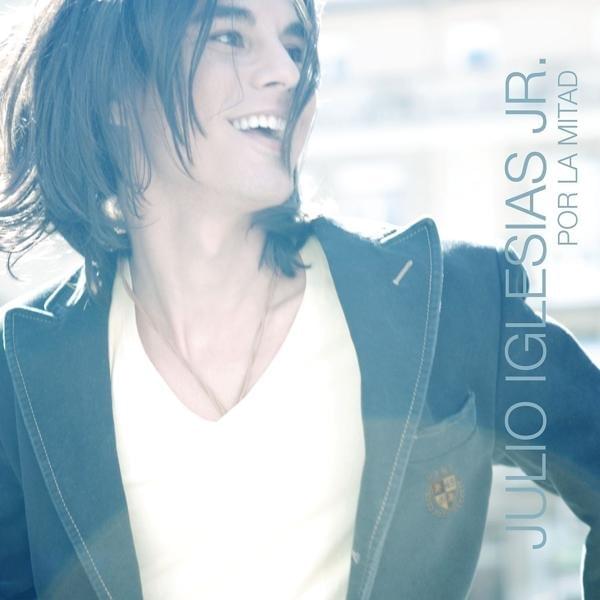 Album cover art for "Por La Mitad" by Julio Iglesias Jr.