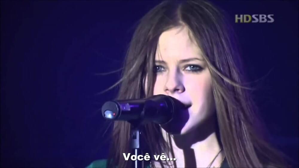 Album cover art for "Avril Lavigne - Naked (Tradução em Português)" by Genius Brasil Traduções