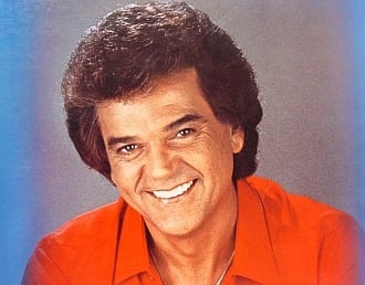 Album cover art for "Guess My Eyes Were Bigger Than My Heart" by Conway Twitty