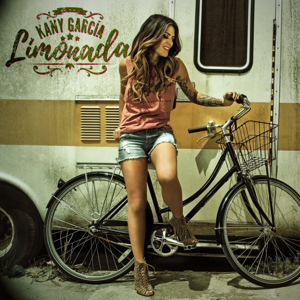 Album cover art for "Aquí" by Kany García & Abel Pintos