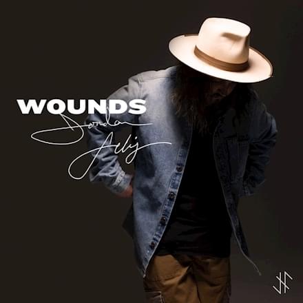 Album cover art for "Wounds" by Jordan Feliz